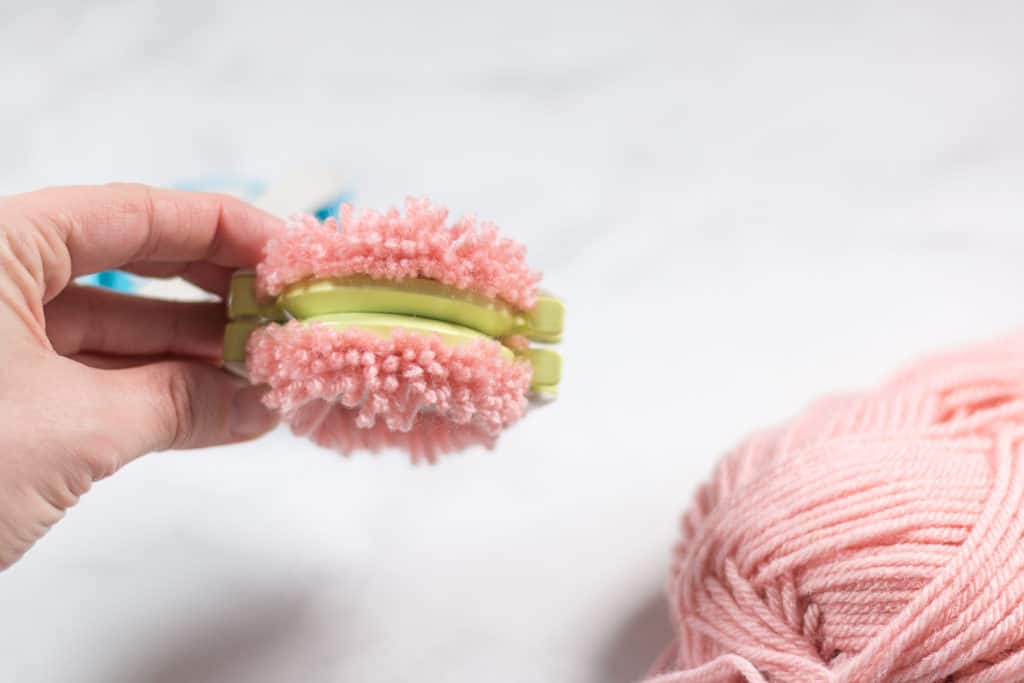 Cut Yarn on a Clover Pom Pom Maker