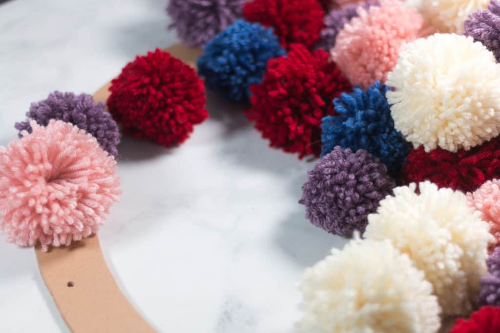 Placement of Pom Poms on wreath