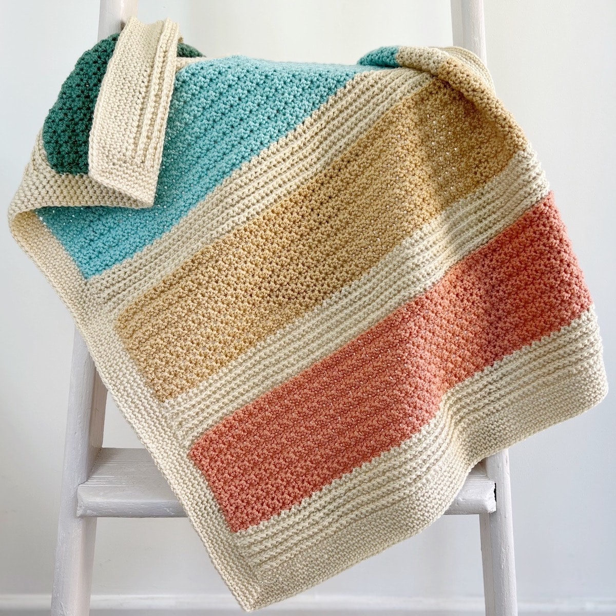 https://easycrochet.com/wp-content/uploads/2022/09/Modern-striped-crochet-blanket-set.jpg